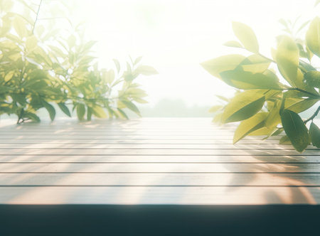 wooden table top with spring green leaves as frame and free space for text.の写真素材