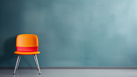 modern design of chairs in various colors artfully arranged in front of a gradient gray wall. This composition highlights the chairs' aesthetic appeal and their potential to enhance interior spacesの素材