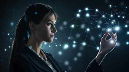 a businesswoman as she meticulously draws out a global network structure and client connection data exchange on a dark backgroundの素材