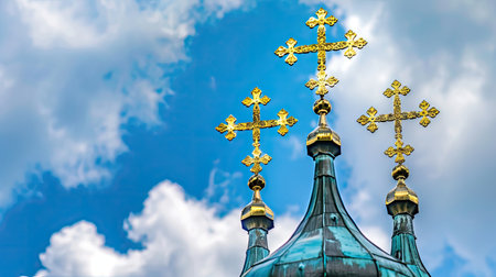 a church building adorned with golden crosses and symbols atop its roof, set against a backdrop of clear blue sky, radiating a sense of spiritual reverence and divine serenityの素材