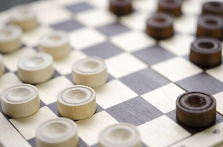 Party of wooden checkers close up. The strategy.の写真素材
