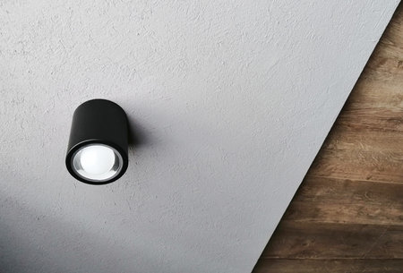 unusual ceiling with a modern lamp and different levels