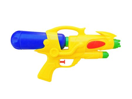 toy for boys water gun of yellow color from plastic on a white backgroundの写真素材