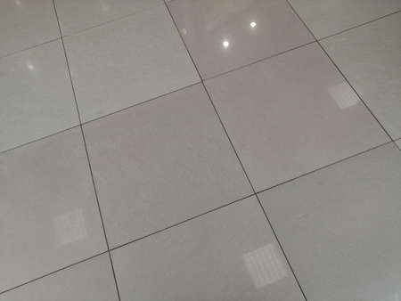 Brown ceramic floor tiles closeup texture. tile, floor tilesの写真素材