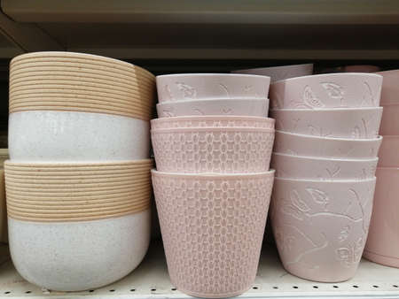 ceramic pots for flowers on a shelf in a storeの写真素材