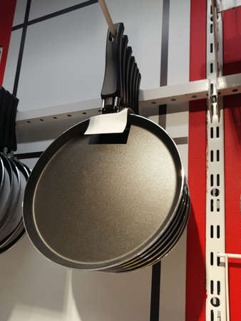 frying pan in the store. dishes for frying in the kitchenの写真素材