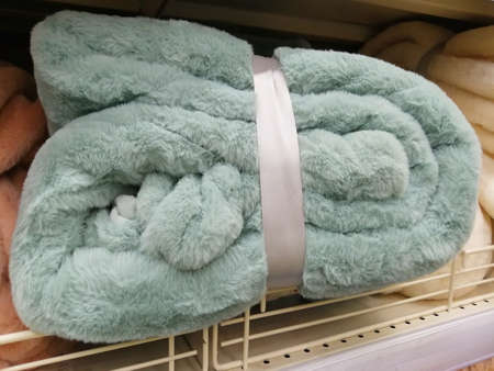 blanket plaid on the shelf in the store. testil for homeの写真素材