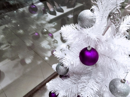 purple toy on a white Christmas tree. christmas tree in storeの写真素材