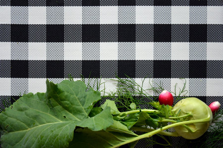 Vegetables are on the cutting Board. ingredients for vitamin salad on a checkered background.