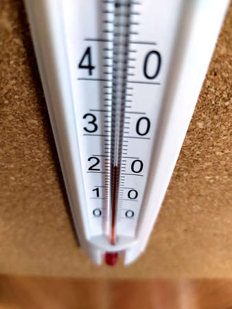 A close-up of a thermometer. Air heating indicator. The thermometer shows the room temperature.の写真素材