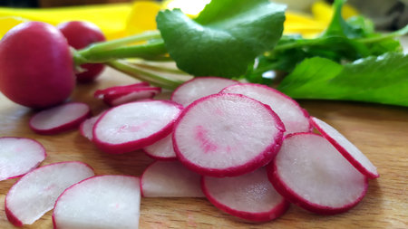 Red radish close-up. Early fresh vegetables for making dietary vitamin salad. Organic vegetables lie...