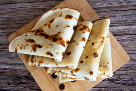 Pancakes. Pancakes stacked in a stack on a wooden background. View from above. Diet baked goods for breakfast.の写真素材