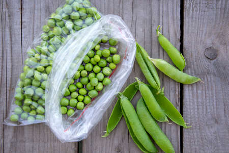 Green peas are in a bag. Harvesting fresh vegetables from the garden.の写真素材