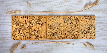 Cookie banner. Dry biscuits with sunflower seeds and dry sedge stalks.