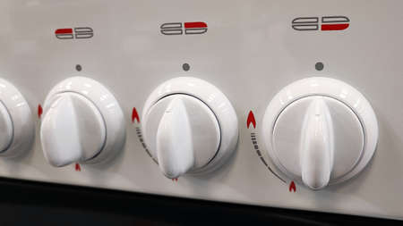 Gas stove. Selective focus on gas stove adjusting screws. New household appliances for the kitchen.の写真素材