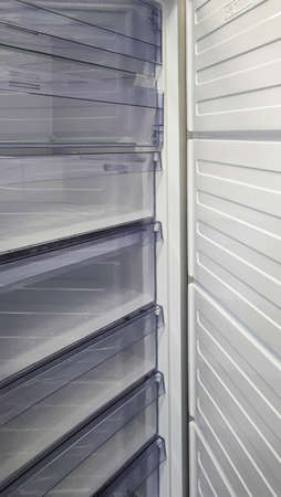 Household refrigerator with open door. new home appliances.の写真素材