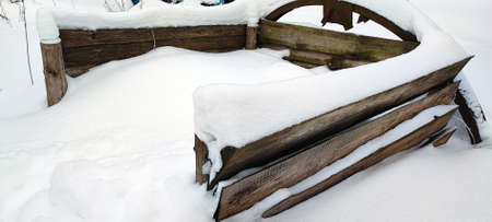 Compost pit in winter. A place for harvesting humus, covered with snow.の写真素材