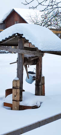 Well with water in winter. Use of water in winter.の写真素材