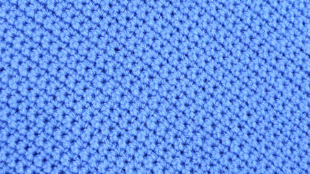 Crochet loops. Crocheted blue background.の写真素材