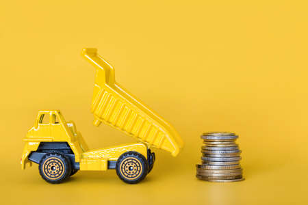 Yellow cargo truck. Cargo transportation, delivery service. Transport company. Saving money. Infrastructure and logistics. Place for textの写真素材