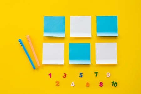 Back to school concept.Top view of school supplies on yellow background with empty space for text. Flat lay of kindergarten or school supplies.の写真素材