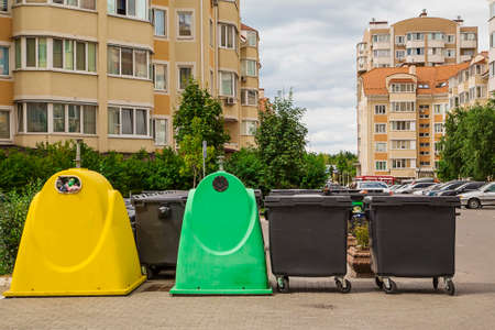 Plastic trash can for separate garbage collection. Green, yellow and black trash cans. Garbage sortingの写真素材