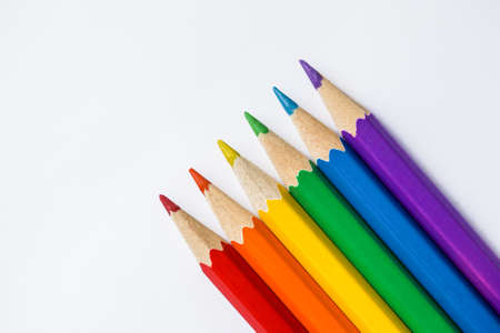 Colored Rainbow Pencils school supplies on white background. Copy spaceの写真素材