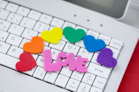 Online Dating, Computer keyboard with Symbol Heart in LGBT pride colorsの写真素材
