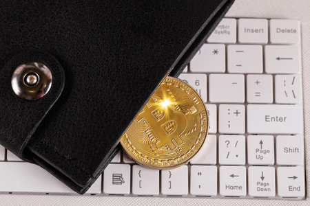 Wallet Gold Bitcoin on keyboard, button Enter. Crypto technology concept