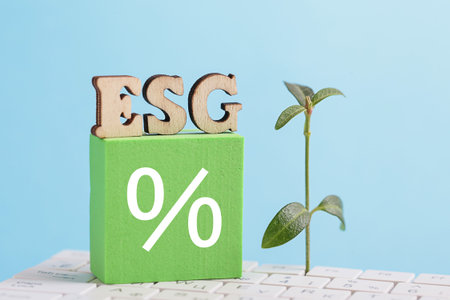 ESG Credit percentage. ESG, white computer keyboard, blue background. Environmental, Social,...