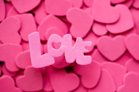 Word Love, pink heart. Valentines Day festive background. Concept Donorship, life saving or charity.