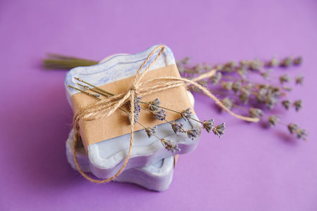 Handmade natural bath spa lavender soap on violet background. Soap making. soap bars. Spa, skincare....
