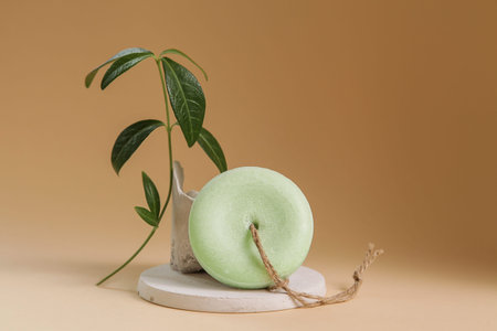 Handmade Solid Dry Shampoos of round shape on plain beige background. Natural Hair Cosmetics. Soap Handicraft. Environmentally friendly products, no wasteの写真素材