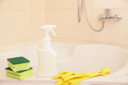 Household Chemicals Mockup. Protection Glove Yellow, Green Sponge, Liquid Cleaning solution Cleaning Acrylic Bath, Disinfection and Hygiene Conceptの写真素材