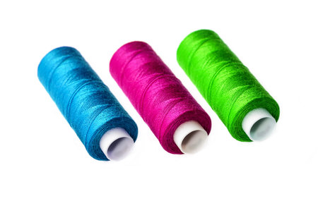 Rainbow Spools of thread isolated on a white background