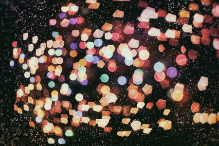 Bokeh light, shimmering blur spot lights on beige abstract background.の写真素材