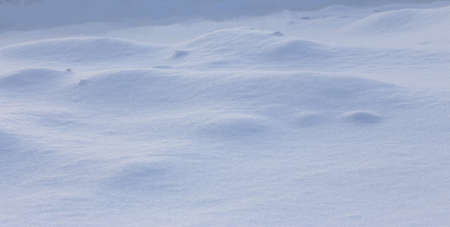 A large beautiful snowdrift.Winter snow background. A big snow drift