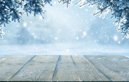 Holidays background.Winter landscape with fir tree branch. Xmas concept.Merry Christmas and happy New Year greeting card with table in snow.の写真素材