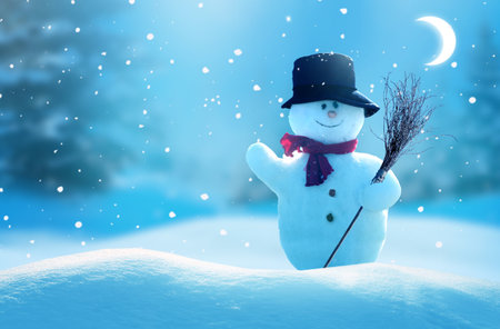 Happy snowman standing in christmas night landscape.Snow background.Winter fairytale.Merry christmas and happy new year greeting card with copy-space.の写真素材
