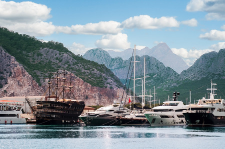 Sea harbor with yachts among mountains in Mediterraneanの写真素材