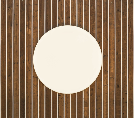 Wood textured background with empty white circle frameの写真素材