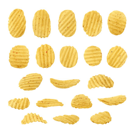 Rippled potato chips with spices isolated on white backgroundの写真素材