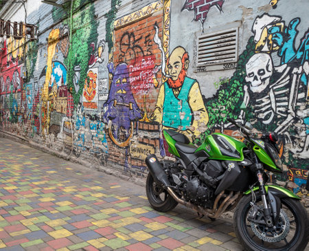 Krasnodar, Russia - May 23, 2021: Sport motorcycle and color graffiti wall. Urban street backgroundのeditorial素材