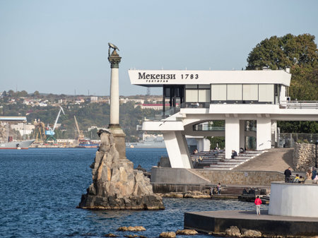 Sevastopol, Crimea - October 8, 2021: Monument to the Sunken Ships and Mekenzi restaurant in Sevastopol bayのeditorial素材