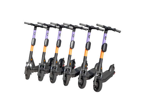Group of electric kick scooters in row isolated on white backgroundの写真素材
