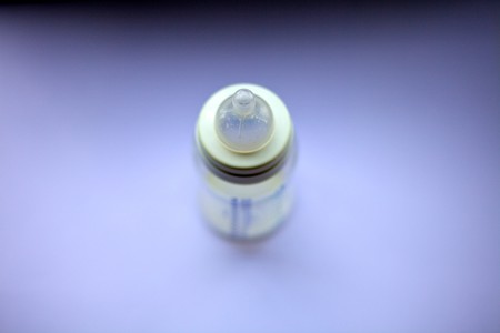 Blurry photo of a baby's bottleの写真素材