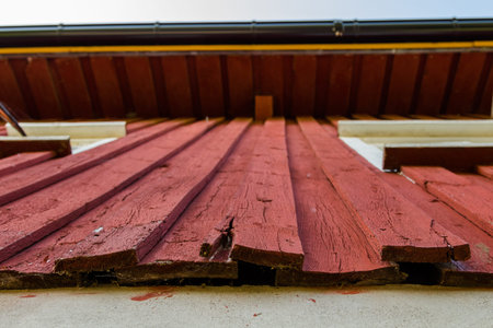 Painted old wooden wall needs rehabilitation