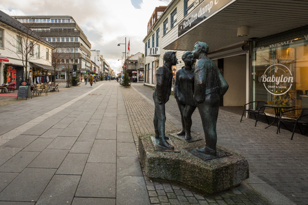 Kristiansand, Norway - November 8, 2017: The statue called Paa Stripa, in Markensgate. Shopping street and pedestrian zone.のeditorial素材