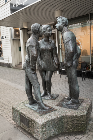 Kristiansand, Norway - December 22, 2017: The statue called Paa Stripa, in Markensgate. Shopping street and pedestrian zone.のeditorial素材