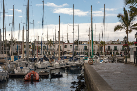 Puerto de Mogan, Gran Canaria in Spain - December 16, 2017: Sailboats in Puerto de Moganのeditorial素材